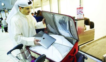 Dubai travelers hit as laptop ban takes off