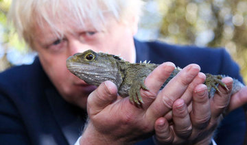 Britain’s Johnson meets lizard at New Zealand sanctuary