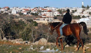 Israel freezes controversial settlement law