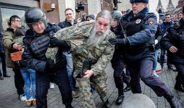 Russian police detain over 400 at anti-Putin protests, say monitors