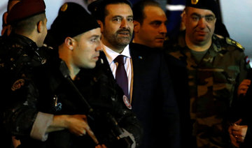 Hariri, back in Beirut, attends national day parade