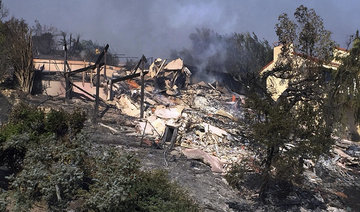 Hundreds flee as fires randomly take, spare California homes