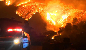 Monster fire slows as California homeowners pick up pieces