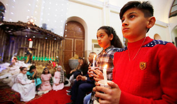 For Iraq’s Christians, a bittersweet first Christmas home after Daesh