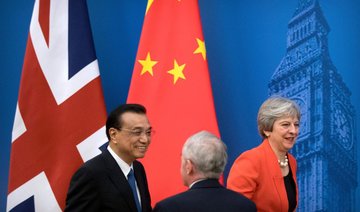 On China visit, Britain’s Theresa May focused on post-Brexit future