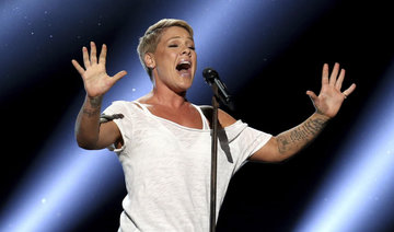 With the flu, Pink powers through pre-Super Bowl concert