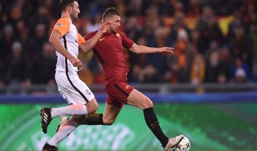 Dzeko strikes to take Roma into Champions League last eight