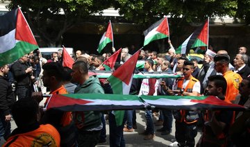 Gazans bury their dead after bloody clashes, West Bank closes to mourn