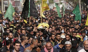 Thousands gather in Gaza for funerals of shot protesters