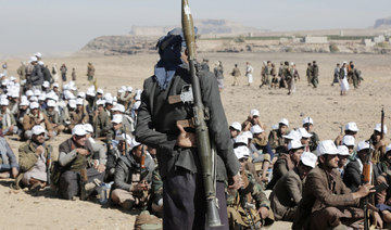 Houthi fighters attend a rally of support for the Palestinians in the Gaza Strip and against the US strikes on Yemen. (AP)