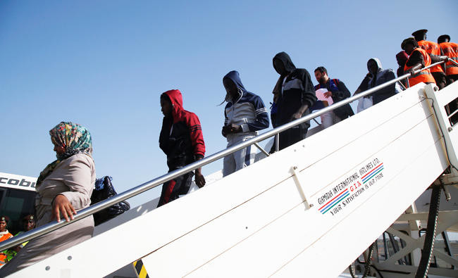 Gambia migrants return after Libya prison ordeal