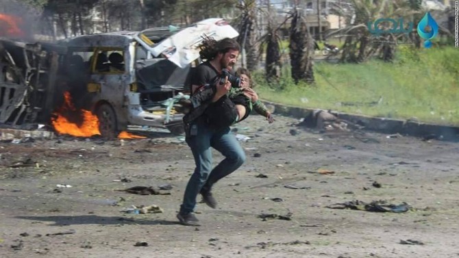 Syrian photographer praised for saving child after convoy bombing