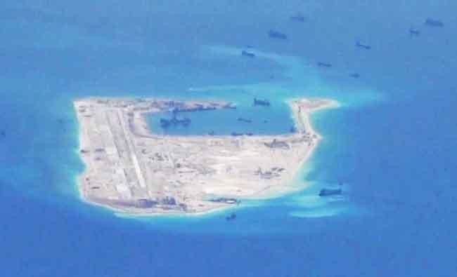 China installs rocket launchers on disputed South China Sea island