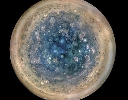 NASA releases never-before-seen photos of Jupiter's stormy poles