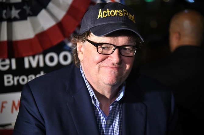 Michael Moore leads audience of Broadway play to Trump Tower