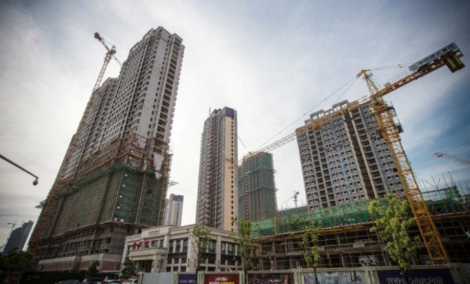 Chinese cities impose new property controls to curb speculation