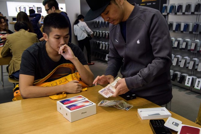 Apple’s iPhone X hits Asia stores as profits soar