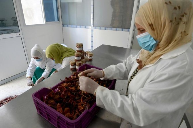 Women in rural Tunisia mix hot sauce with business