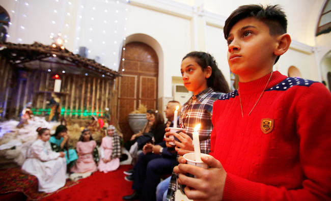 For Iraq’s Christians, a bittersweet first Christmas home after Daesh