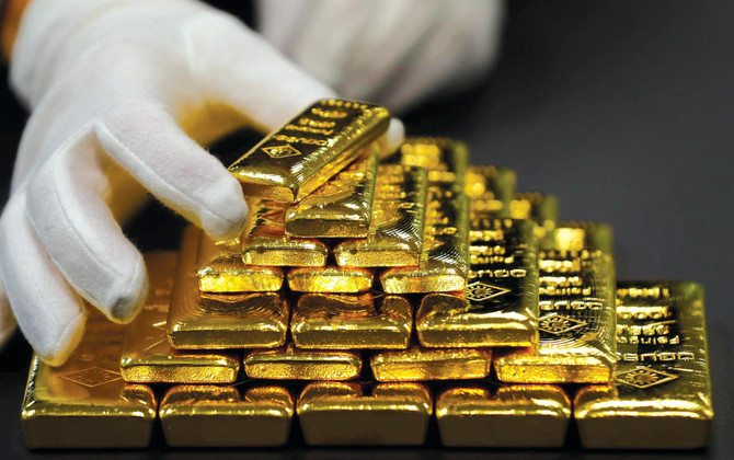 Gold hits four-week low on firmer dollar amid US rate hike forecasts