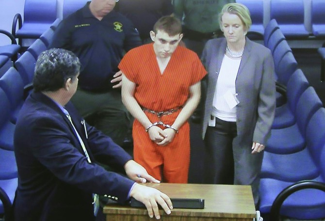 Former student confesses to Florida school shooting