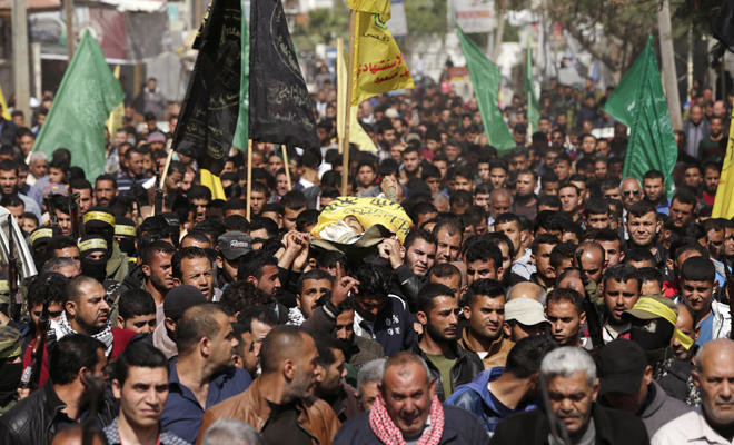 Thousands gather in Gaza for funerals of shot protesters